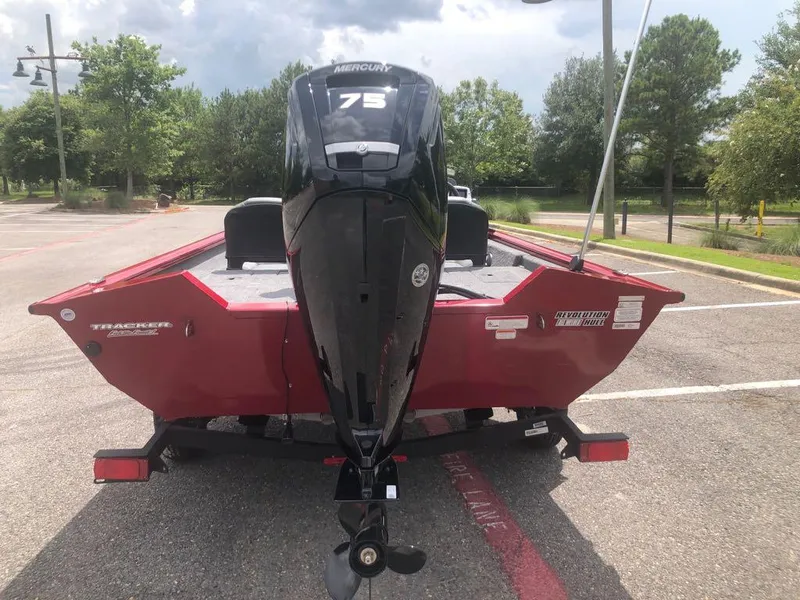 Slide: The Image of 2025 Tracker Pro Team 175 Crappie Edition boat with Mercury 75 engine in parking lot. - 9