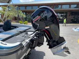 Slide: The Image of 2025 Ranger 1850MS boat with powerful outboard motor in a sunny outdoor setting. - 5