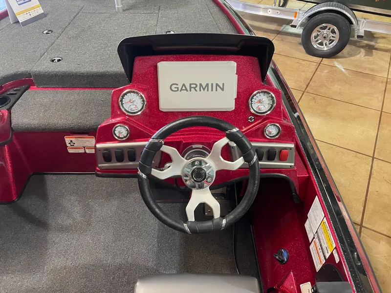Slide: The Image of 2025 Nitro Z19 Pro boat dashboard with Garmin display and steering wheel. - 10