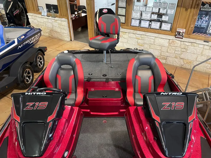 Slide: The Image of 2025 Nitro Z19 Pro boat interior with red and gray seating, showroom display. - 11