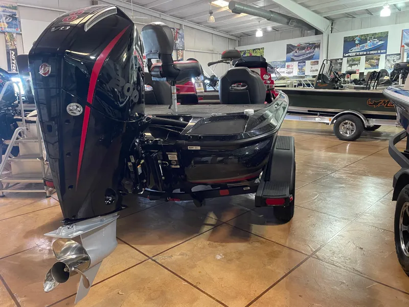 Slide: The Image of 2025 Nitro Z19 Pro boat in showroom, featuring sleek black design and powerful outboard motor. - 3