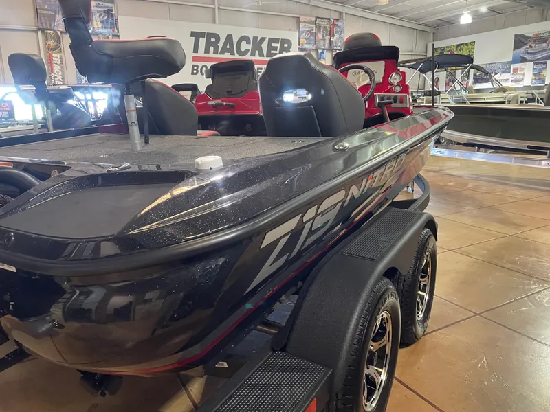 Slide: The Image of 2025 Nitro Z19 Pro boat displayed in showroom, featuring sleek design and modern features. - 4