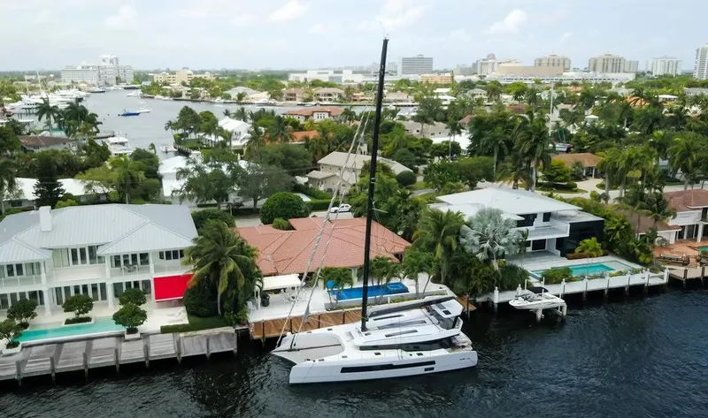 Slide: The Image of Aerial view of 2026 McConaghy MC62 yacht docked by waterfront homes. - 3