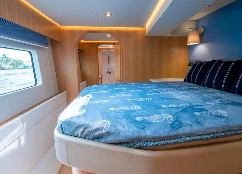 Slide: The Image of Luxurious cabin interior of 2026 McConaghy MC62 yacht with cozy bed and modern lighting. - 7