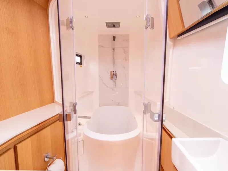 Slide: The Image of Luxurious bathroom in 2026 McConaghy MC62 yacht with modern bathtub and sleek design. - 8