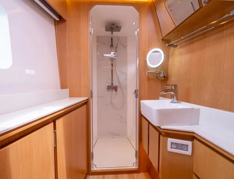 Slide: The Image of Luxurious bathroom interior of 2026 McConaghy MC62 yacht with modern fixtures and wooden finishes. - 9