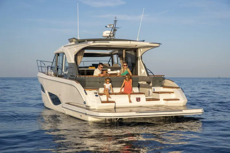 Slide: The Image of 2025 Marex 440 Gourmet Cruiser on calm sea with people enjoying the deck. - 25