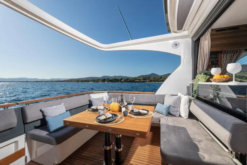 Slide: The Image of Luxury dining area on 2025 Marex 440 Gourmet Cruiser yacht with ocean view. - 30