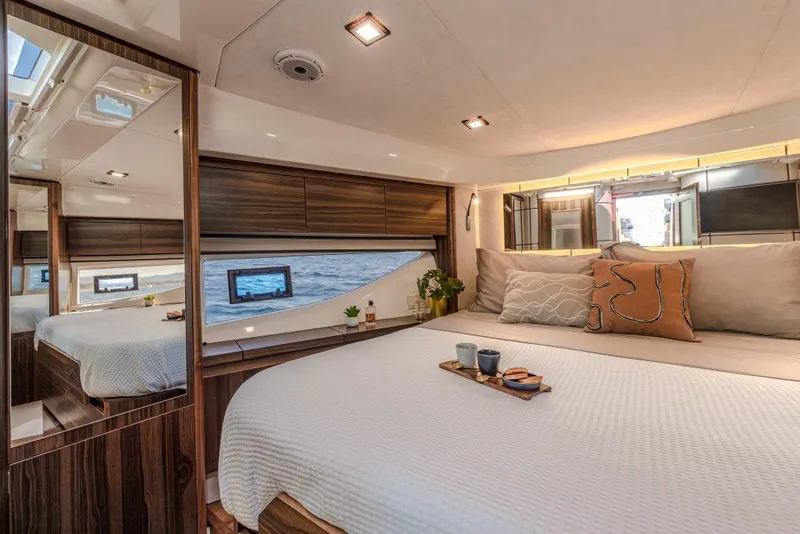 Slide: The Image of Luxurious cabin interior of 2025 Marex 440 Gourmet Cruiser with elegant wood finishes. - 36