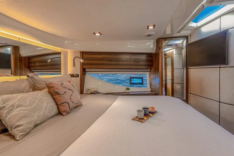 Slide: The Image of Luxurious bedroom interior of 2025 Marex 440 Gourmet Cruiser yacht with ocean view. - 37