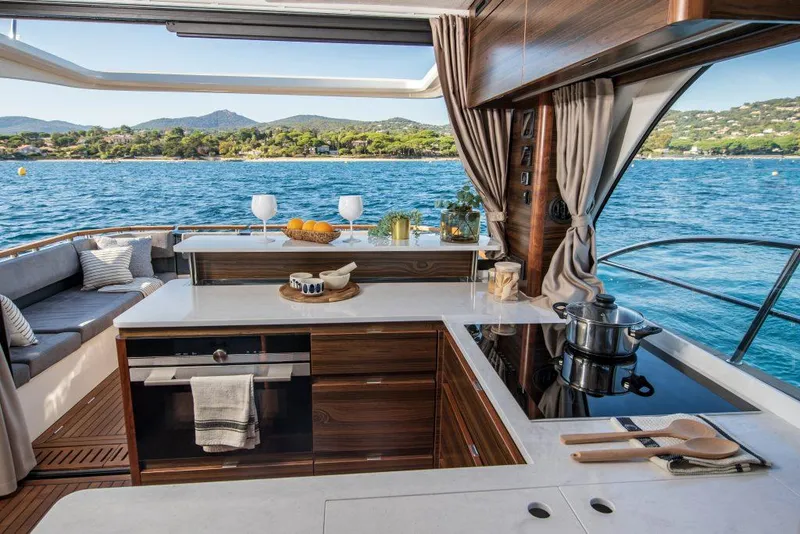 Slide: The Image of Luxurious kitchen on 2025 Marex 440 Gourmet Cruiser yacht with scenic ocean view. - 39