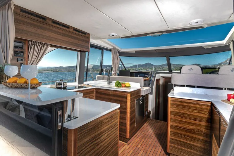 Slide: The Image of Luxurious interior of 2025 Marex 440 Gourmet Cruiser with modern kitchen and scenic views. - 40