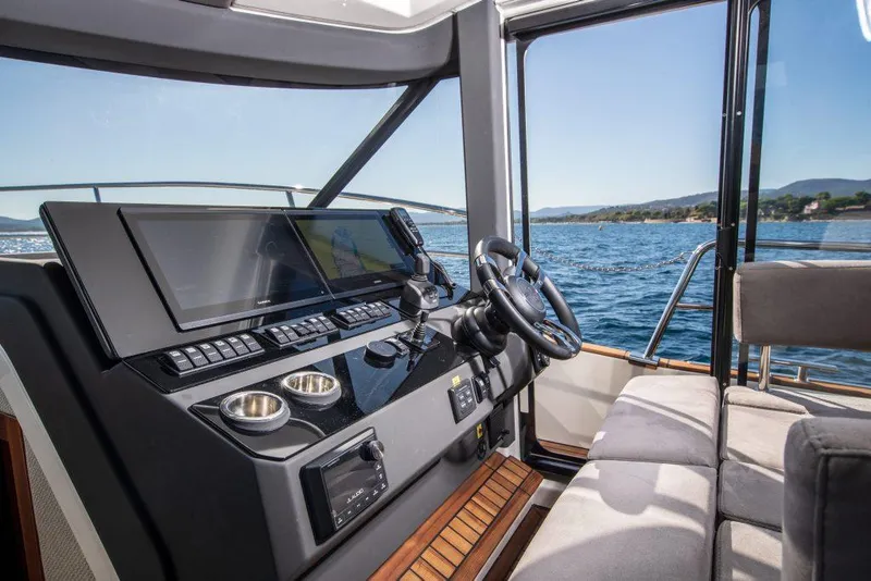 Slide: The Image of Interior of 2025 Marex 440 Gourmet Cruiser with modern helm and ocean view. - 42