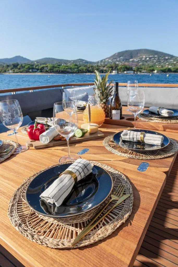 Slide: The Image of Luxury dining setup on 2025 Marex 440 Gourmet Cruiser yacht, with scenic ocean view. - 47