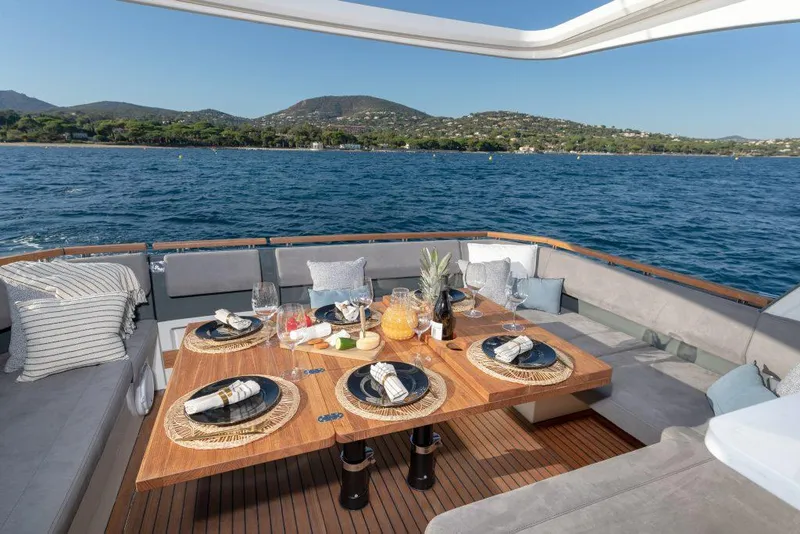 Slide: The Image of Luxurious dining setup on 2025 Marex 440 Gourmet Cruiser yacht with ocean view. - 49