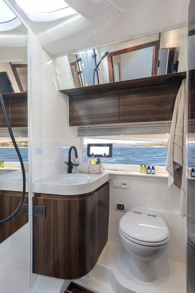 Slide: The Image of Luxurious bathroom in 2025 Marex 440 Gourmet Cruiser yacht with modern fixtures and ocean view. - 35