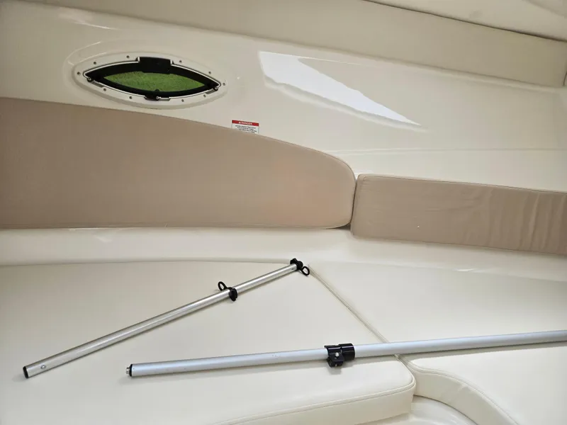 Slide: The Image of 2015 Bayliner 642 Overnighter interior with seating and window. - 30