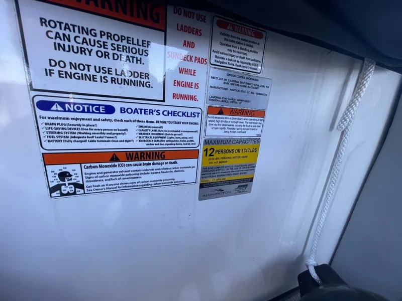 Slide: The Image of Safety warnings and capacity limits on a 2021 Bennington 24LSR boat. - 13