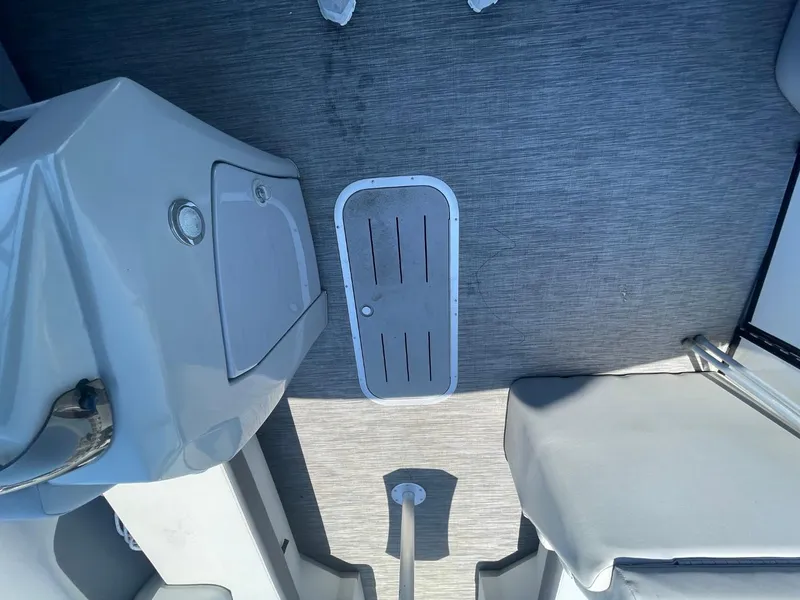 Slide: The Image of Interior view of a 2021 Bennington 24LSR boat, featuring a sleek, modern design. - 21