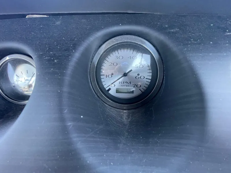 Slide: The Image of Dashboard of 2021 Bennington 24LSR showing RPM gauge. - 25