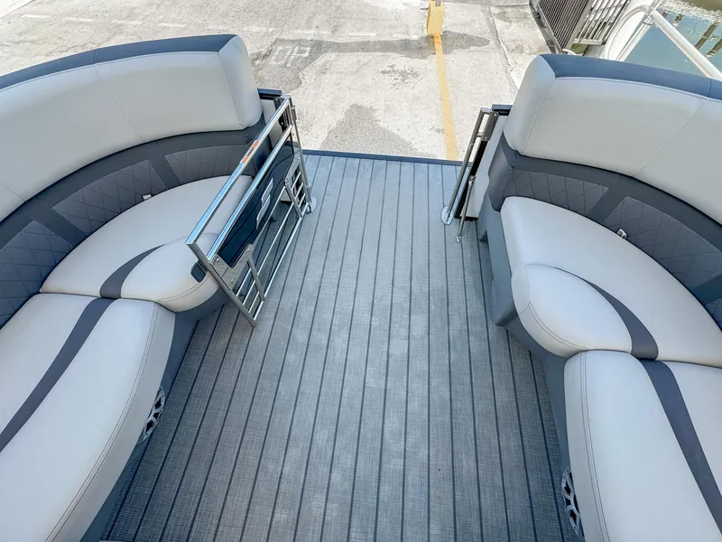 Slide: The Image of 2024 Starcraft CX 23 Q DH boat interior with gray seating and flooring. - 17