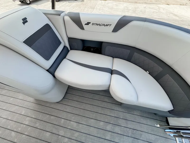 Slide: The Image of 2024 Starcraft CX 23 Q DH boat interior with gray cushioned seating. - 20