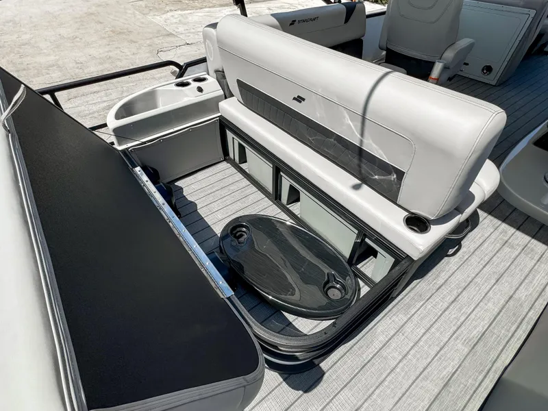 Slide: The Image of 2024 Starcraft CX 23 Q DH boat interior with seating and storage compartments. - 9