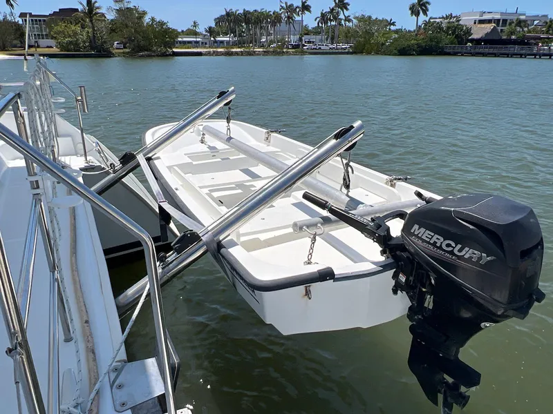 Slide: The Image of Lagoon 420 boat with Mercury outboard motor on calm water, 2008 model. - 16