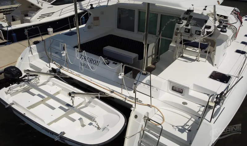 Slide: The Image of 2008 Lagoon 420 catamaran with spacious deck and modern amenities, docked at marina. - 3