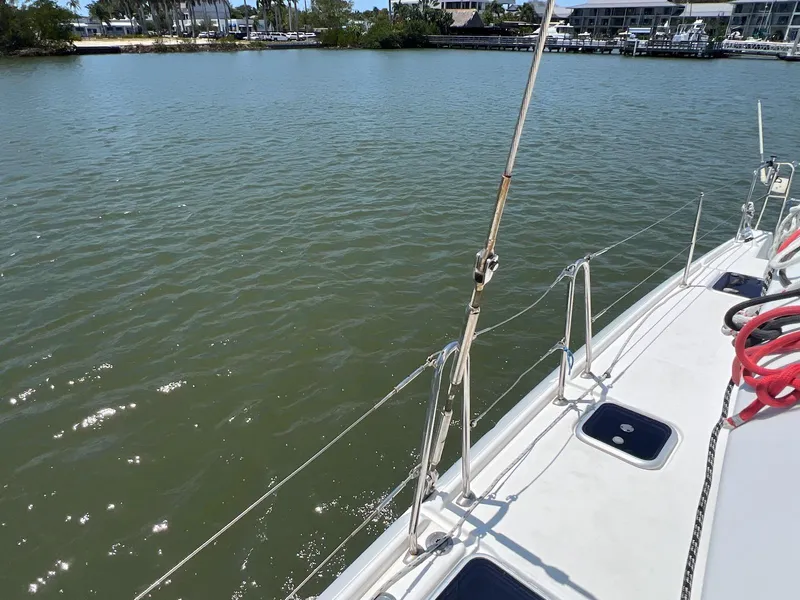 Slide: The Image of 2008 Lagoon 420 sailboat deck with water view and marina in background. - 31