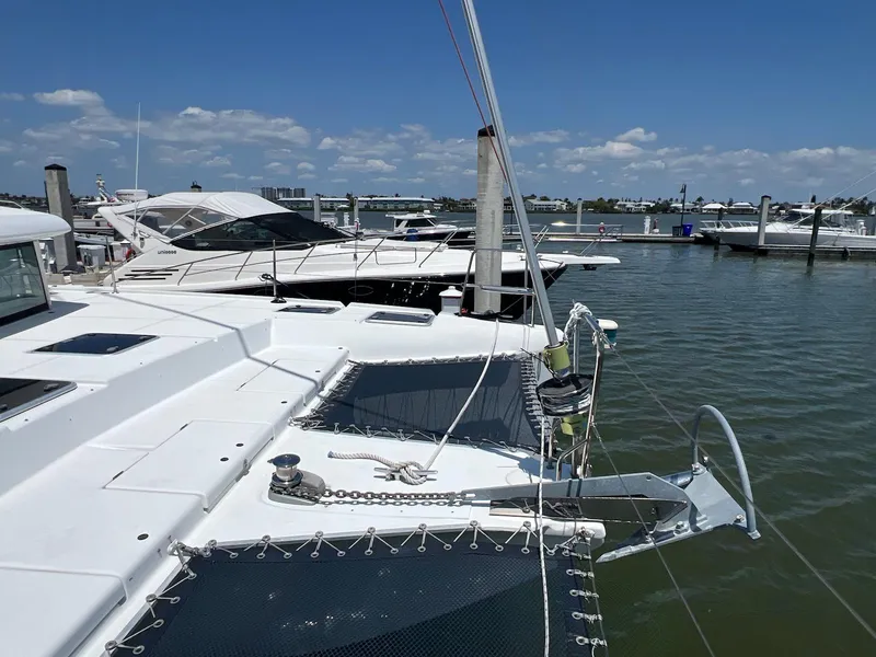 Slide: The Image of Lagoon 420 catamaran docked at marina, sunny day, calm waters, 2008 model. - 36