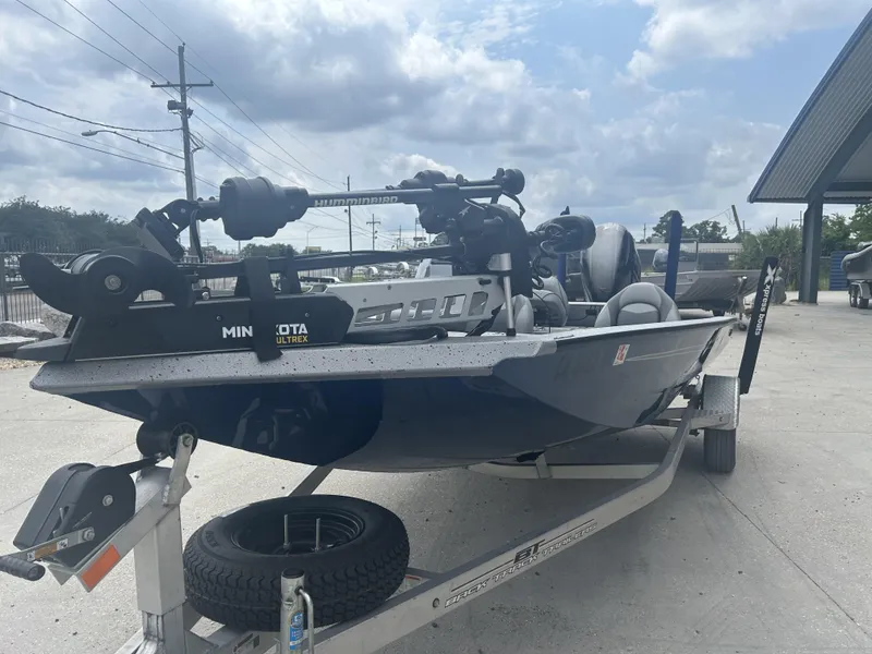 Slide: The Image of 2021 Xpress X19 Pro boat on trailer with Minn Kota Ultrex motor. - 3