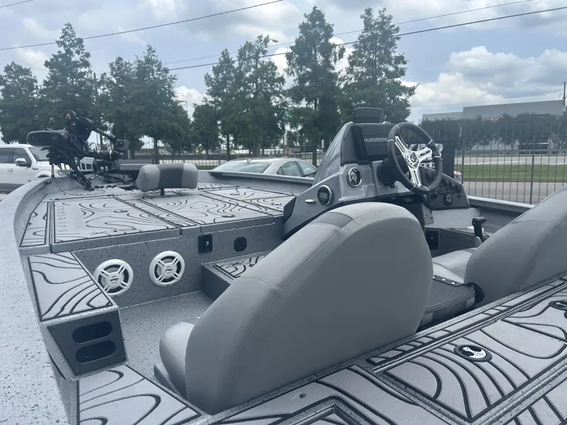 Slide: The Image of 2021 Xpress X19 Pro boat with modern interior and steering console. - 8