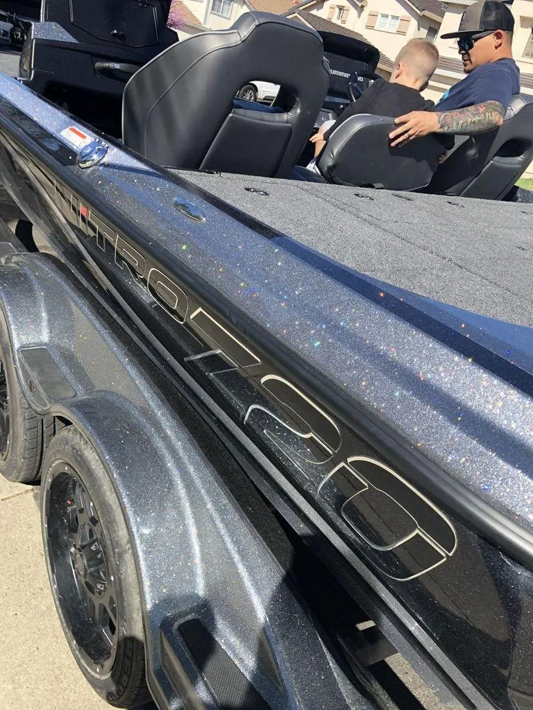 Slide: The Image of 2020 Nitro Z20 boat with glitter finish, featuring passengers seated inside. - 16