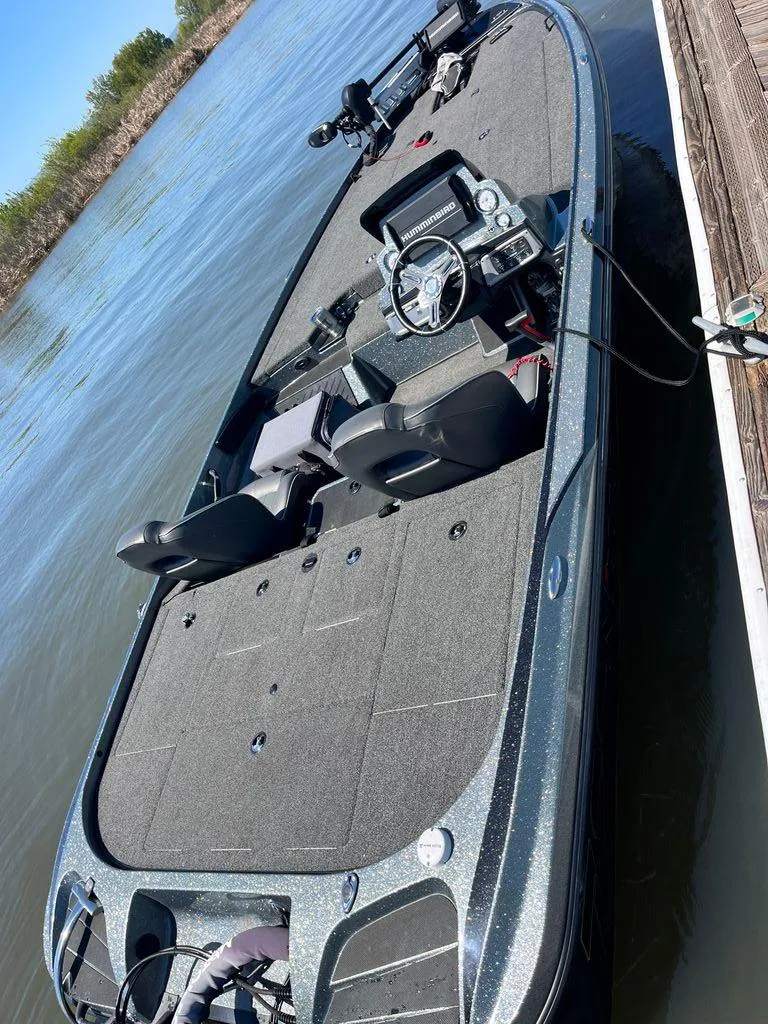 Slide: The Image of 2020 Nitro Z20 boat docked on calm water, featuring dual seats and steering console. - 3