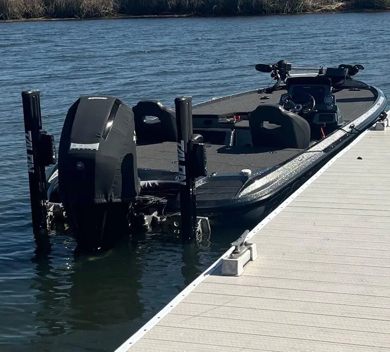 Slide: The Image of 2020 Nitro Z20 boat docked on calm water, featuring sleek design and powerful engine. - 7