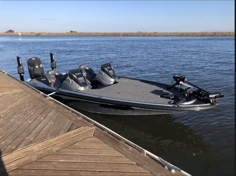 Slide: The Image of 2020 Nitro Z20 boat docked on calm water near a wooden pier. - 9