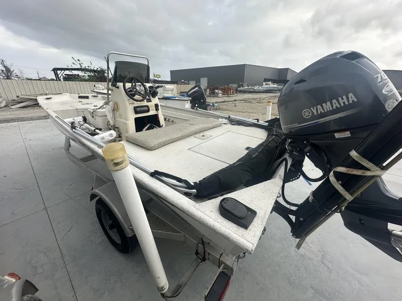 Slide: The Image of 2011 Xpress 18 CC boat with Yamaha motor on trailer, parked outdoors. - 3