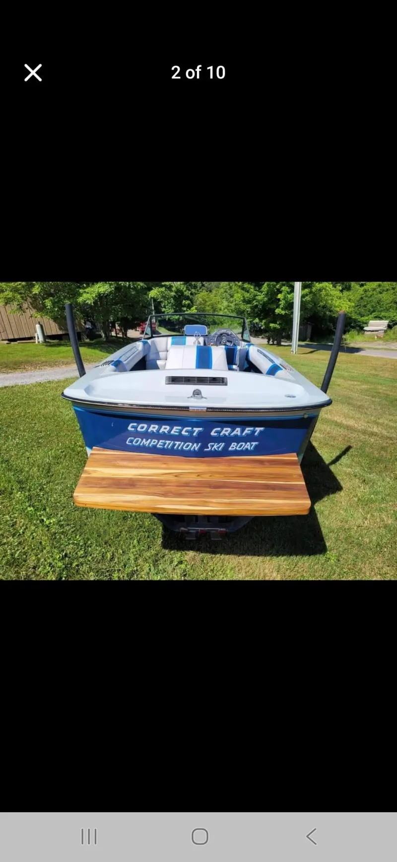 Slide: The Image of 1986 Correct Craft Ski Nautique boat on grass, rear view. - 3