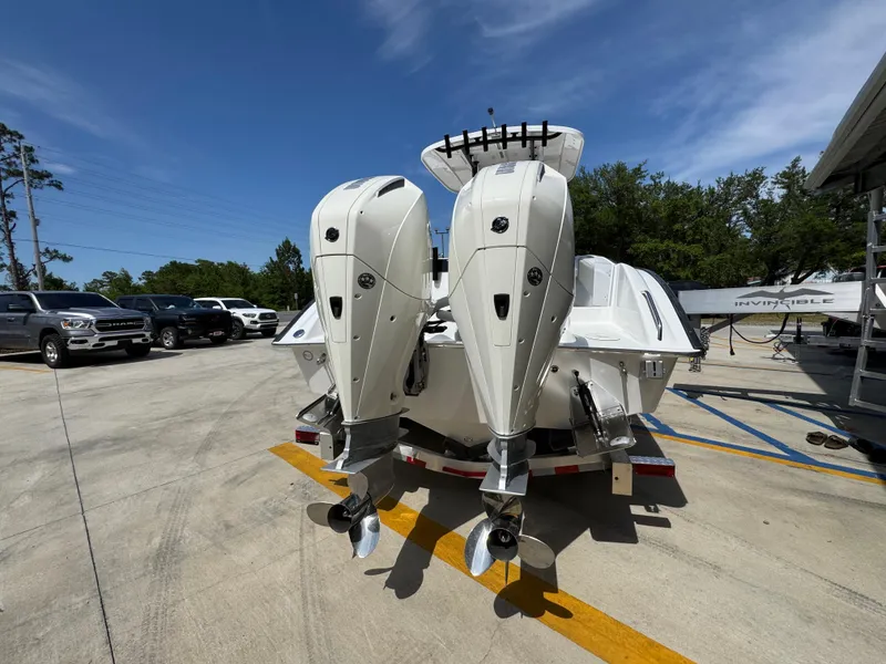 Slide: The Image of 2025 Cape Horn 27 XS boat with dual outboard motors on a trailer. - 12