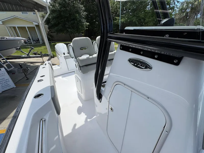 Slide: The Image of 2025 Cape Horn 27 XS boat interior with seating and storage compartments. - 24