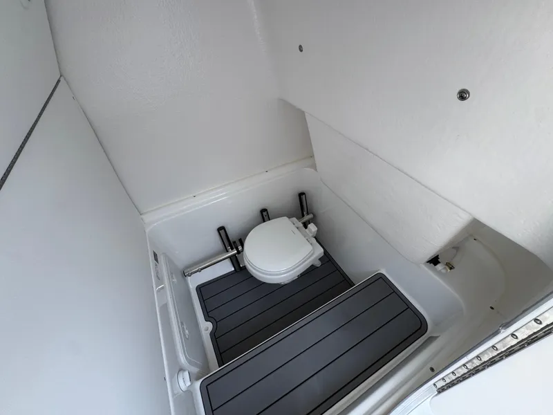 Slide: The Image of 2025 Cape Horn 27 XS boat interior with compact marine toilet. - 25
