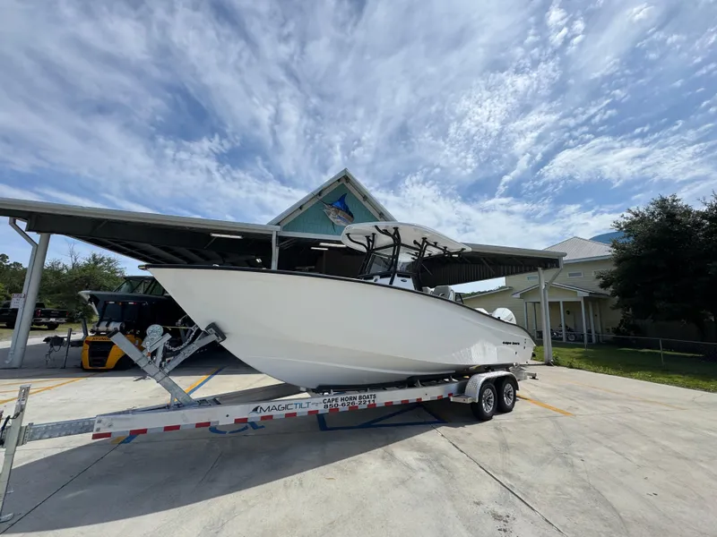Slide: The Image of 2025 Cape Horn 27 XS boat on trailer under cloudy sky. - 3