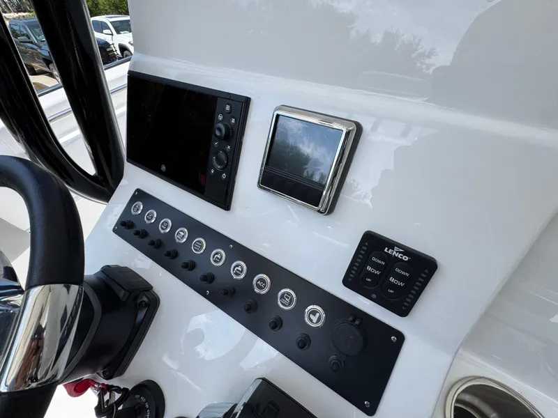 Slide: The Image of Control panel of 2025 Cape Horn 27 XS boat with modern navigation equipment. - 30