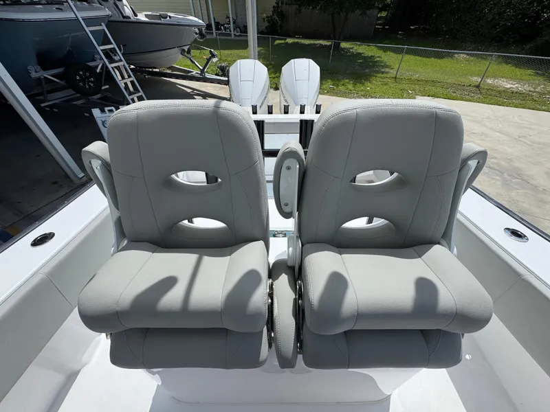 Slide: The Image of 2025 Cape Horn 27 XS boat with dual gray captain seats. - 32