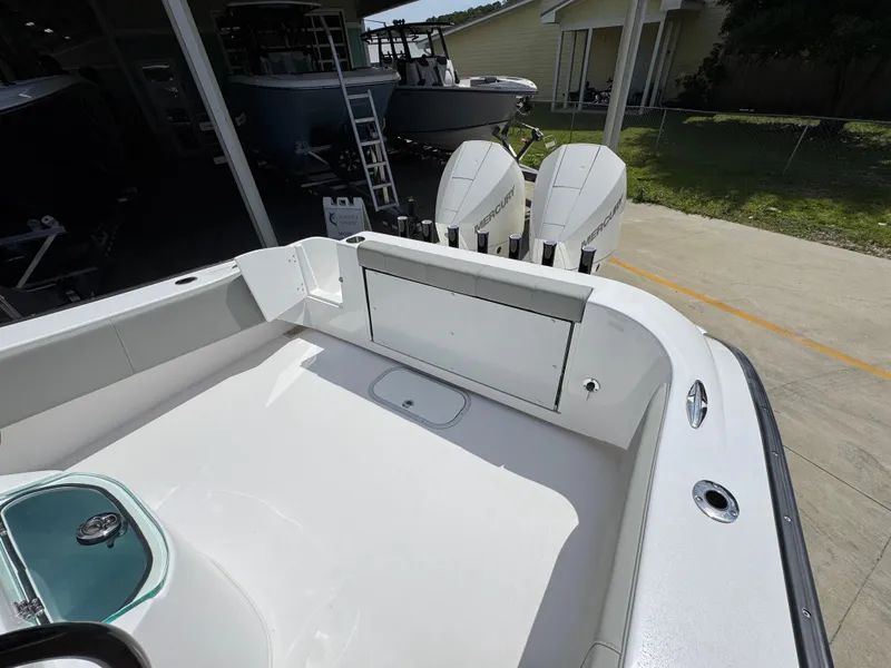 Slide: The Image of 2025 Cape Horn 27 XS boat with dual outboard motors, spacious deck, and storage compartment. - 35