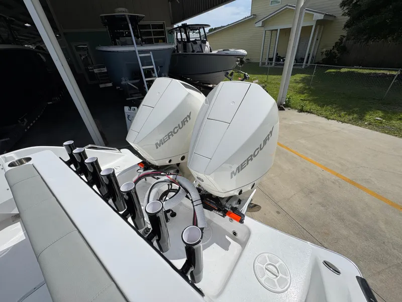 Slide: The Image of 2025 Cape Horn 27 XS boat with dual Mercury outboard engines in a marina setting. - 37