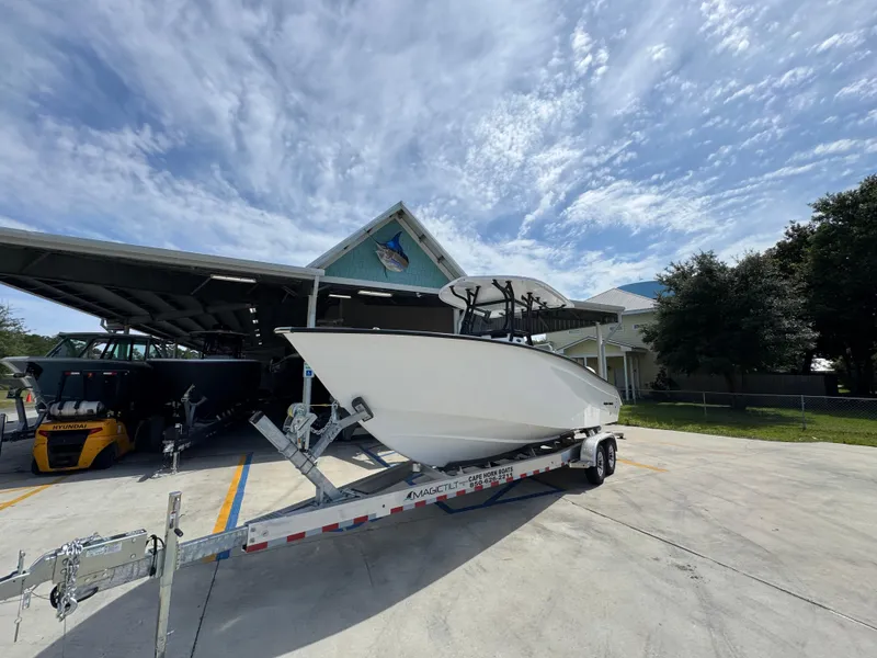 Slide: The Image of 2025 Cape Horn 27 XS boat on trailer under cloudy sky. - 4