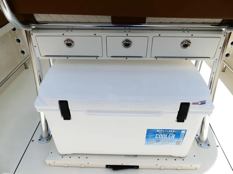 Slide: The Image of Engel cooler on Pioneer 222 Islander 2026 boat with storage drawers above. - 14