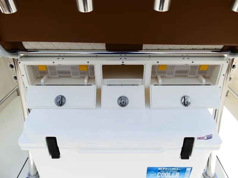 Slide: The Image of 2026 Pioneer 222 Islander boat storage compartments with Engel cooler. - 15